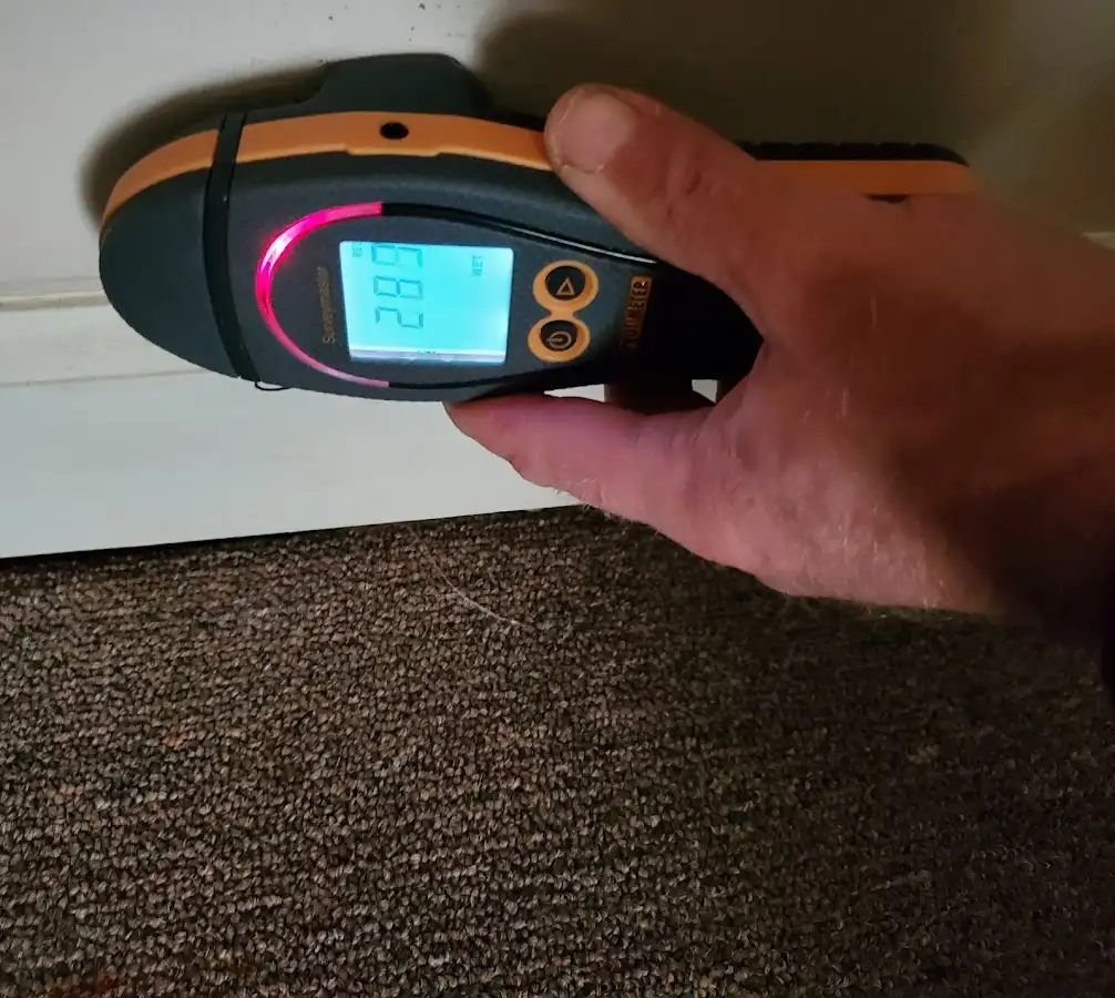 Moisture detection at baseboard during Storm Damage Restoration in Murphysboro